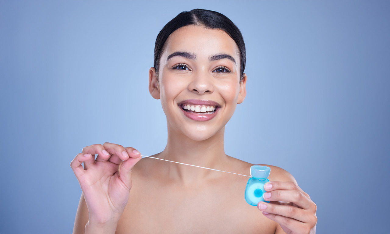 O Herói Silencioso da Sua Saúde Bucal: A Importância Inegável do Fio Dental